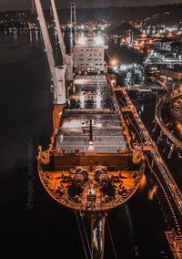 High angle view of illuminated buildings in city at night