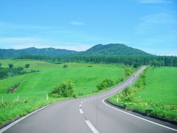 Country road passing through landscape