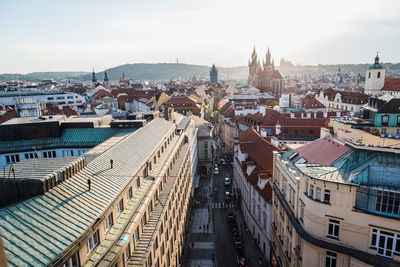 High angle view of street amidst buildings in city against sky