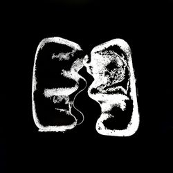 Close-up of heart shape on black background