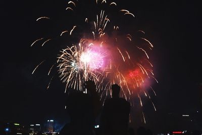 Firework display at night
