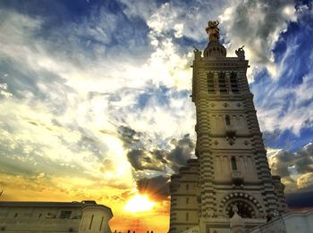 Low angle view of statue against sky during sunset