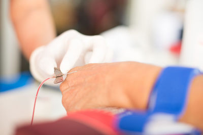 Close-up of person holding hands