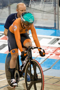 Man riding bicycle on swimming pool