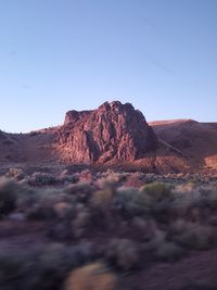 Rock formations in desert against blue sky