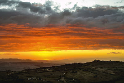 Scenic view of dramatic sky during sunset