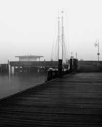 Pier over sea against clear sky