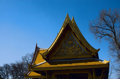 Low angle view of traditional building against clear blue sky