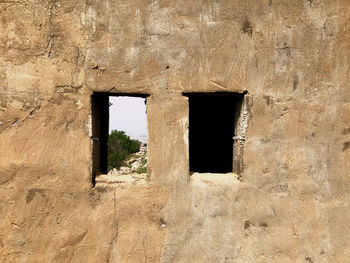 Window on old wall of building