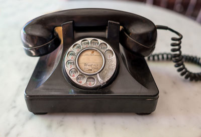 Close-up of telephone on table