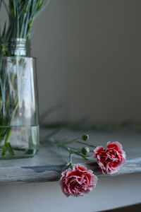 Close-up of roses in vase on table