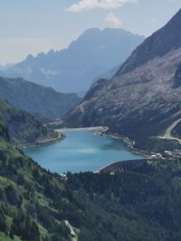 Scenic view of lake and mountains against sky