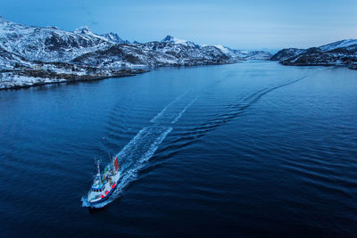 High angle view of boat sailing in lake