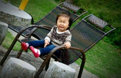 Portrait of cute girl sitting in playground