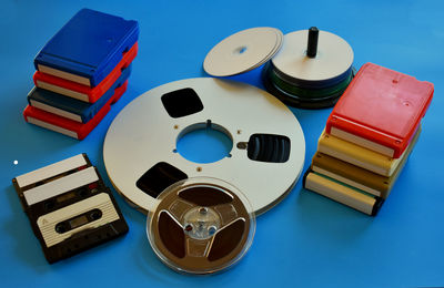 Close-up of reel-to-reel tape against blue background