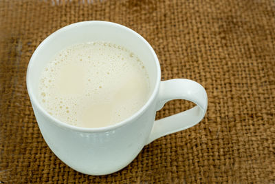 High angle view of coffee cup on table