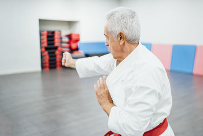 Senior karate master performing combat techniques
