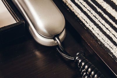 Close-up of telephone on the table in hotel room