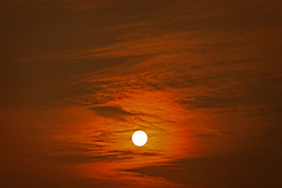 Low angle view of moon against sky at sunset