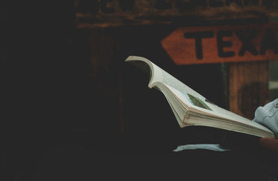 Close-up of hand holding book