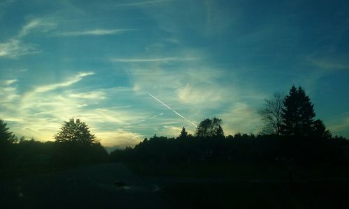 Scenic view of landscape against cloudy sky