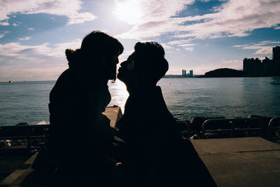 Couple kissing on beach