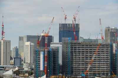 Modern buildings against sky in city