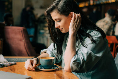 Young woman using mobile phone