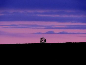 Silhouette of landscape against sky at sunset