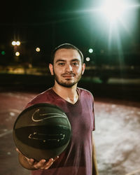 Portrait of young man standing outdoors