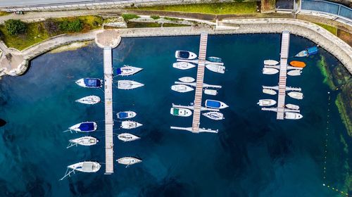 High angle view of sailboats moored in swimming pool