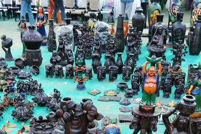 High angle view of figurines for sale in market