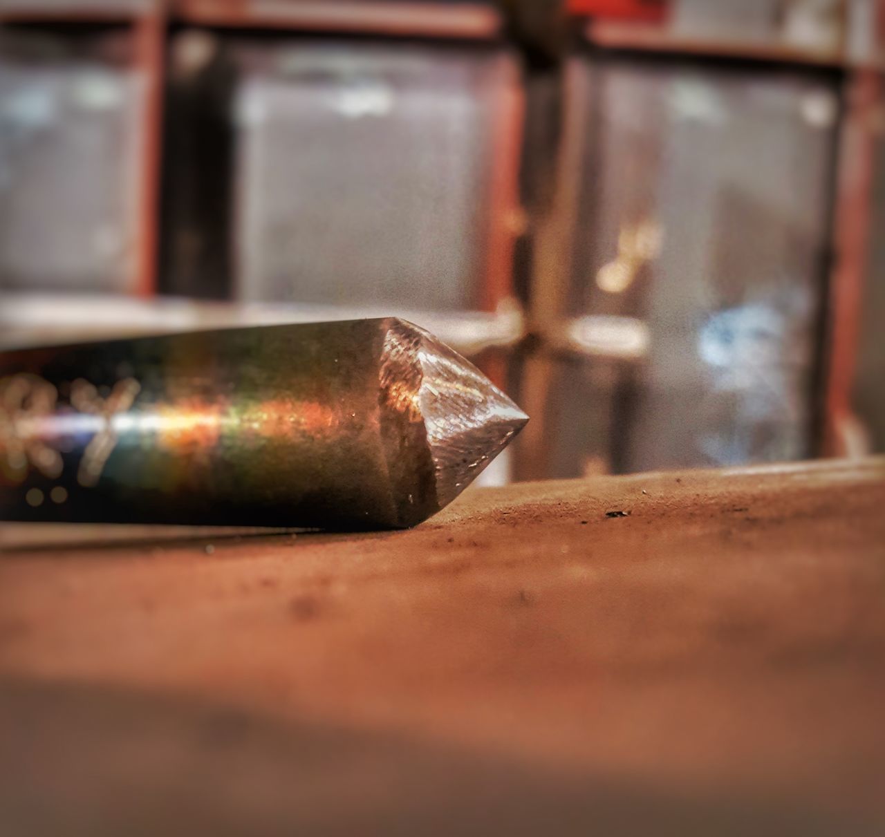 selective focus, indoors, close-up, metal, wood - material, no people, single object, table, rusty, still life, old, technology, workshop, social issues, glowing, food and drink, fuel and power generation, safety