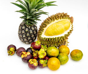 Close-up of fruits against white background