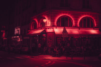 Group of people in illuminated building at night