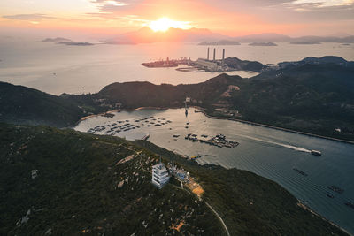 High angle view of sea against sky during sunset