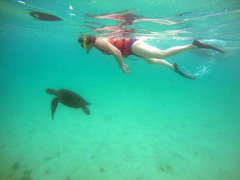 Woman swimming in sea