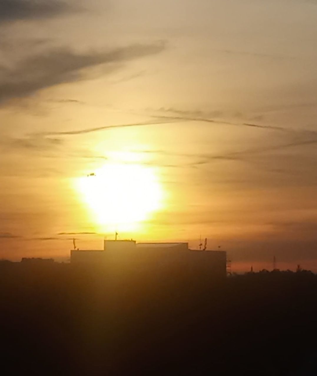 SCENIC VIEW OF SILHOUETTE BUILDING AGAINST SKY DURING SUNSET