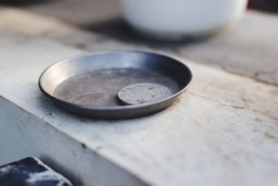 Close-up of coins on table