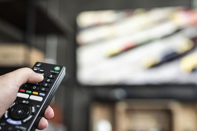 Midsection of man using mobile phone