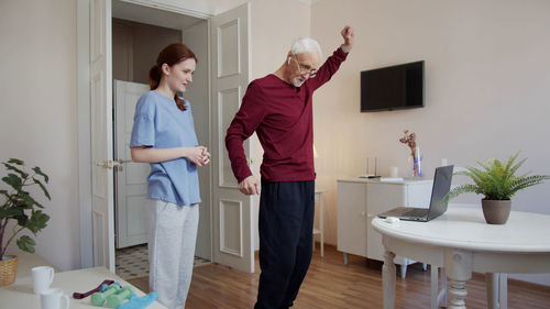 Side view of couple standing in bathroom