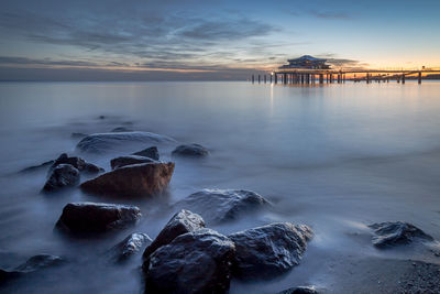 Rocks in front of a pier