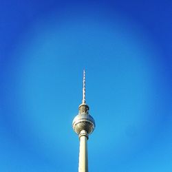 Low angle view of tower against blue sky