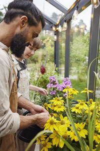 Side view of young man working on field