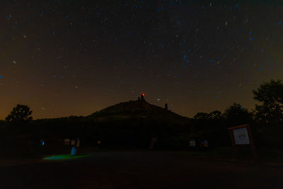 Scenic view of mountains against sky at night