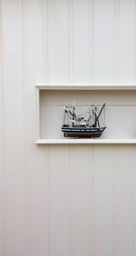 Toy boat against wall at home