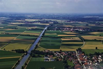 Aerial view of agricultural field against sky