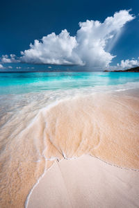 Scenic view of sea against cloudy sky