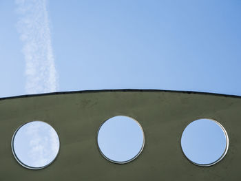 Low angle view of sky seen through airplane window