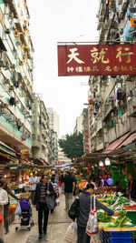 People on street market in city